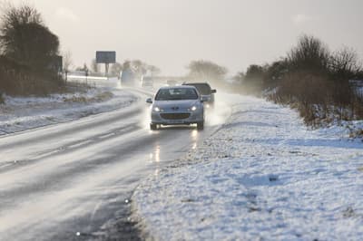 Travel warnings issued as snow and ice hit UK